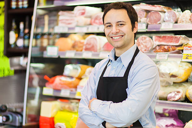 istock Smiling shopkeeper in a grocery store 485692960