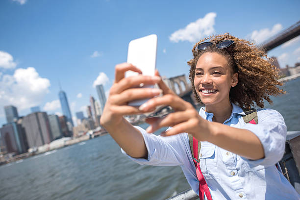 istock Woman taking a selfie on a summer day in NYC 485693328
