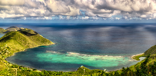 Wooden Boat With Green Hill in Labuan Bajo