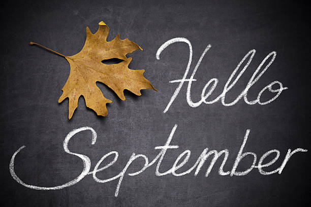 Hello September Autumn  leaves and text ,, Hello September " written on blackboard september stock pictures, royalty-free photos & images