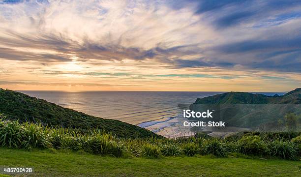 Sunset Bay Stock Photo - Download Image Now - Auckland Region, Backgrounds, Bay of Water