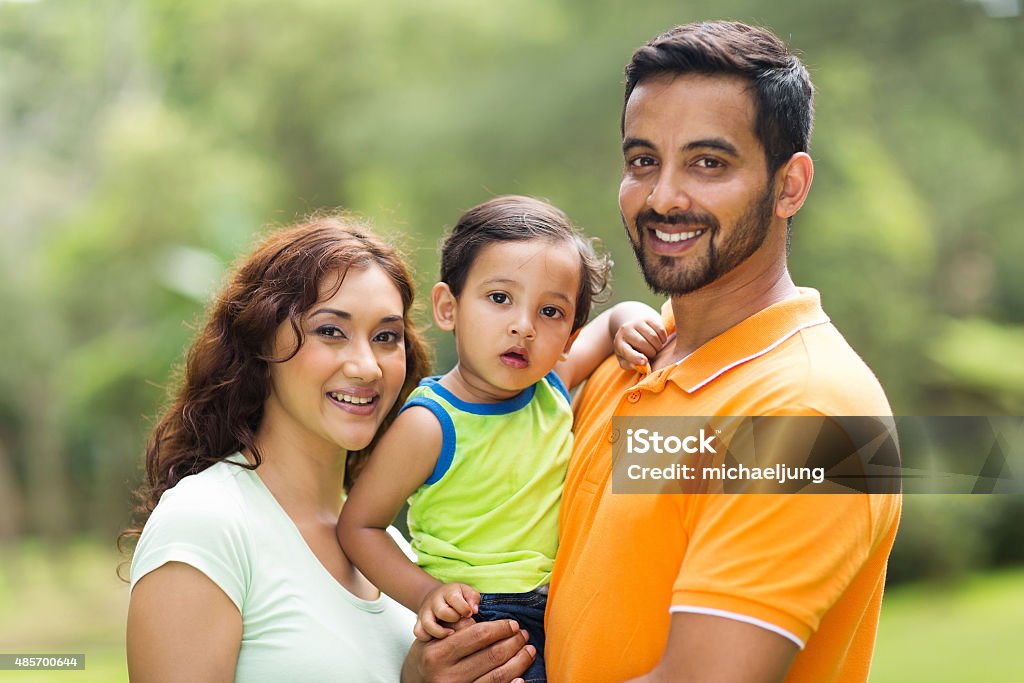 young indian family with the kid young happy indian family with the kid outdoors Family Stock Photo