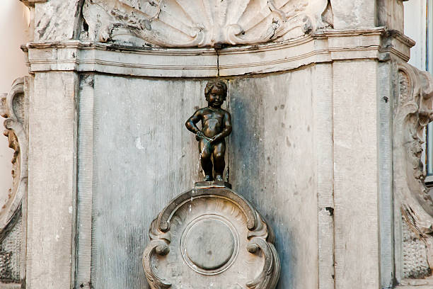 Brussels - Belgium Brussels, Belgium - May 1, 2013: The Manneken Pis (Le Petit Julien) is the most iconic statue of Belgium manneken pis statue in brussels belgium stock pictures, royalty-free photos & images