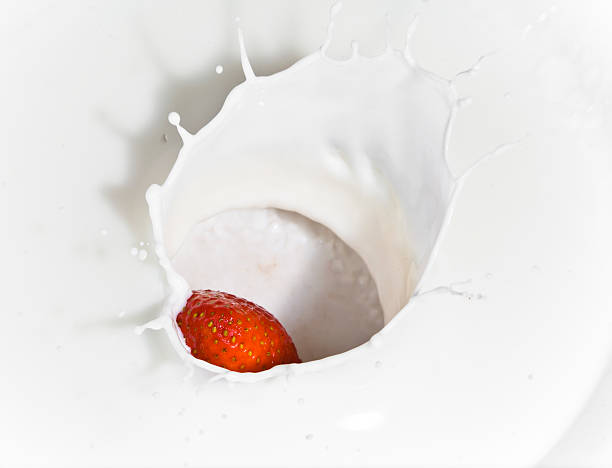 istock The strawberry falling in milk 485705286