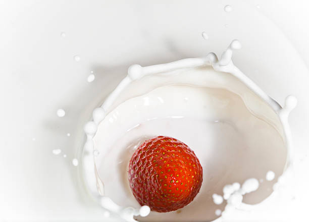 istock The strawberry falling in milk 485705288