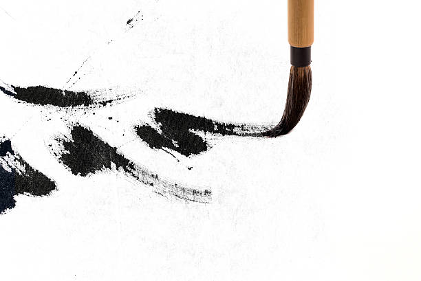 Chinese brushes draw on white papers stock photo