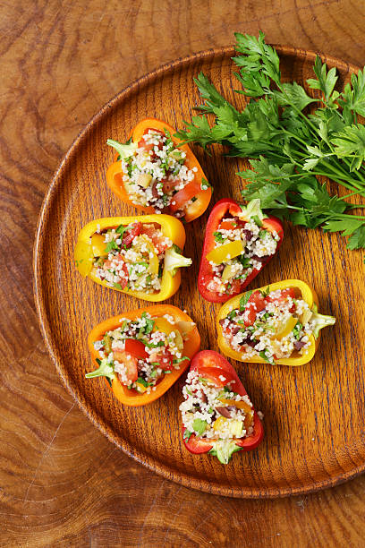 istock salad snack bell peppers stuffed with couscous with vegetables 485705976