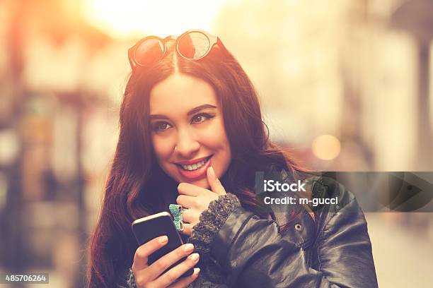 Young Urban Girl Typing Messages Stock Photo - Download Image Now - Adult, Adults Only, Beautiful People