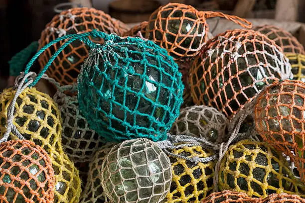 A collection of glass balls in colored net