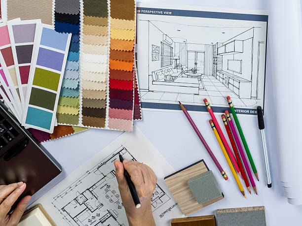 istock Architects/ interior designer hands  drawing of house on creative desk 485711790
