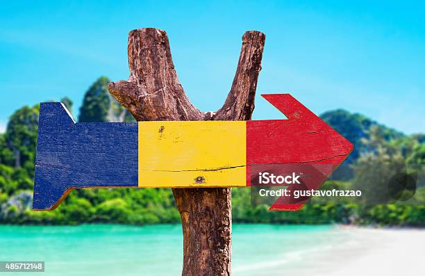 Romania Flag Wooden Sign With Beach Background Stock Photo - Download Image Now - Backgrounds, Beach, Brasov
