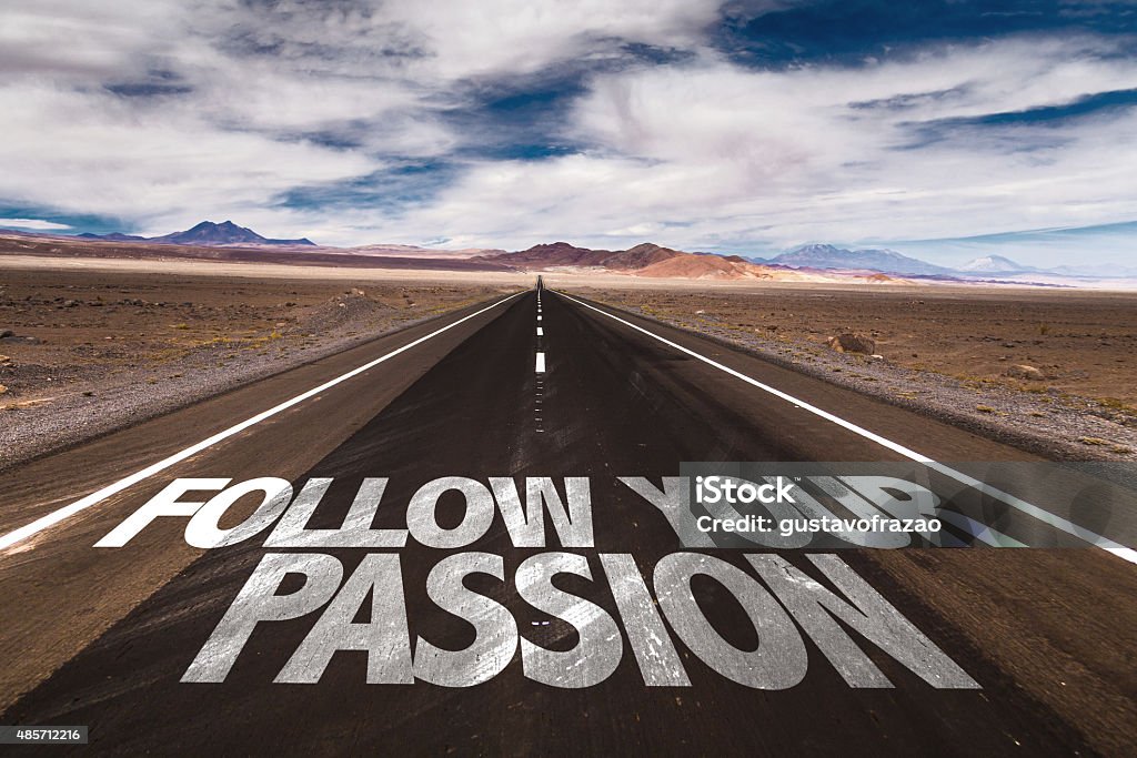 Follow Your Passion written on desert road Passion Stock Photo