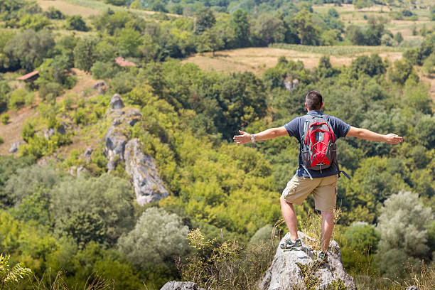 Climber enjoying the great view , serbia Climber enjoying the great view after climbing on top happy end stock pictures, royalty-free photos & images