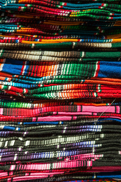 istock Colorful Mexican serapes hang in row 485713926