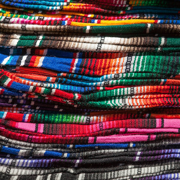 istock Colorful Mexican serapes hang in row 485713928