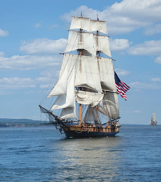 istock Tall ship with American flag sailing on blue waters 485714178