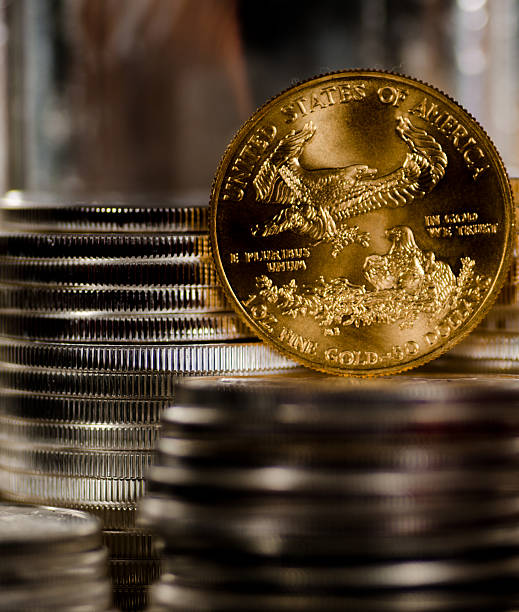 istock US Gold Eagle rests among piles of silver coins 485714916