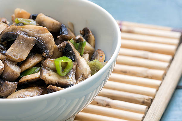 istock mushroom dish in a white bowl on a bamboo mat 485715490