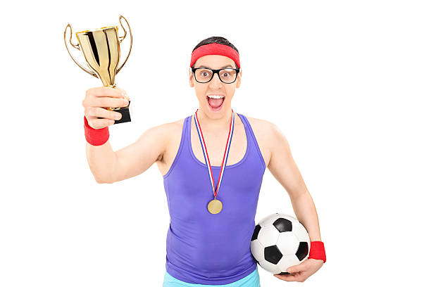 istock Nerdy football player holding a gold cup 485715810