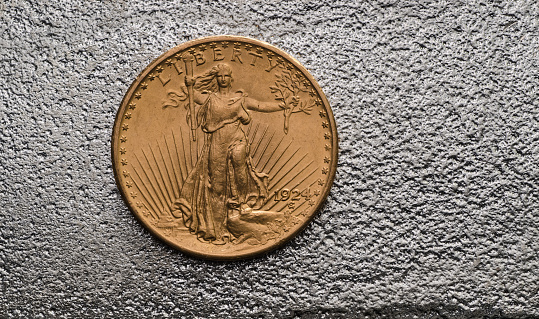 US Gold Coin Saint-Gaudens Double Eagle on SIlver Bar