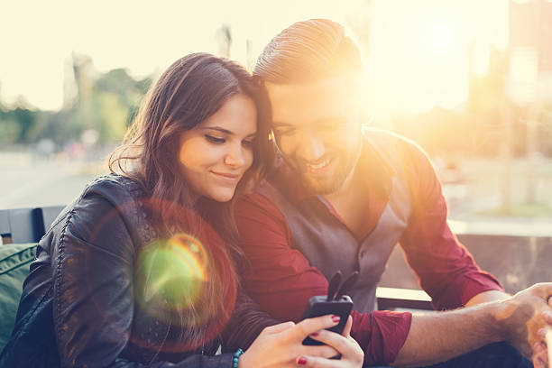 istock Young couple texting on smartphone 485720010