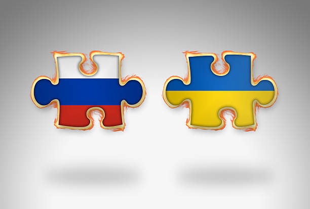 istock Burning 3D Jigsaw Flag of Ukraine and Russia 485721378