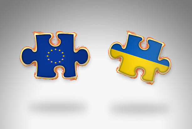 istock Burning 3D Jigsaw Flag of Ukraine and EU 485721382