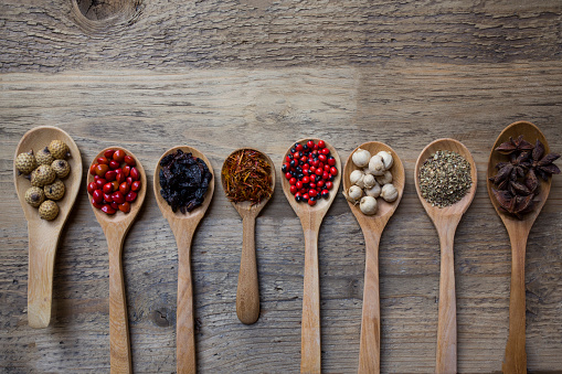 Spices on wood spoons