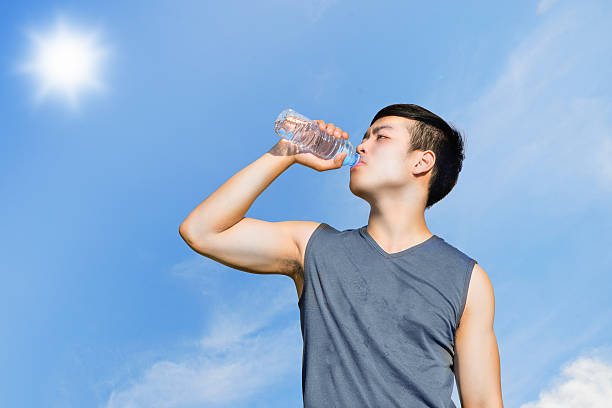 istock Sport and healthy concept : Thirsty athlete drinking water after 485724736