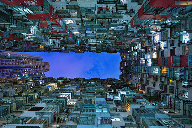 istock Old Dense Hong Kong Building at night 485724758