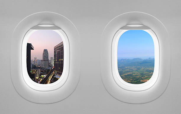 istock Two view window plane, sunset city and blue sky mountain 485726076