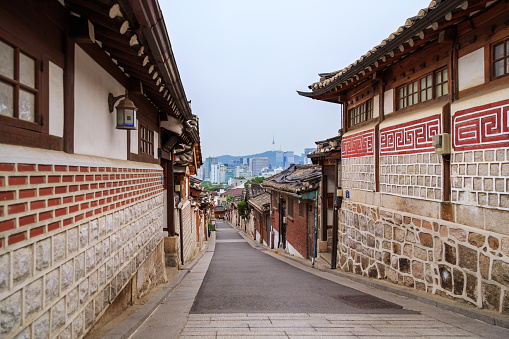 Seoul, South Korea - JUNE 15, 2015: Bukchon Hanok Village is a Korean traditional village, The traditional village is composed of lots of alleys, hanok and is preserved to show a 600-year-old urban environment. Now it is used as a traditional culture center and hanok restaurant, allowing visitors to experience the atmosphere of the Joseon Dynasty.