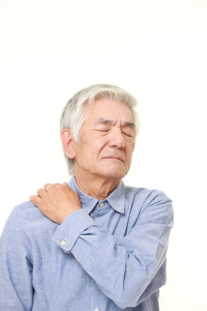 istock senior Japanese man suffers from neck ache 485727618