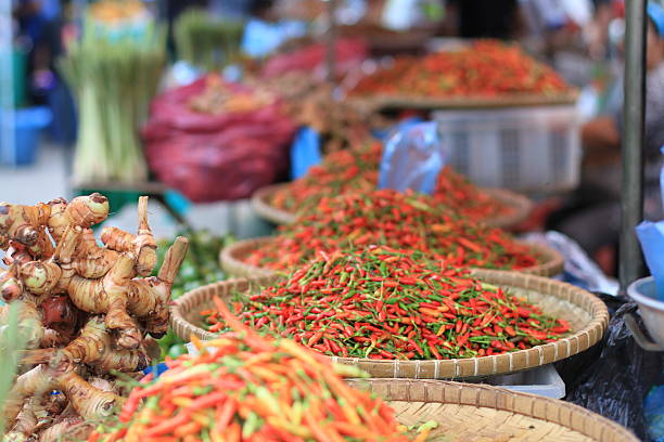 Red peppers for sale in the evening on a street market in southeast Asia.