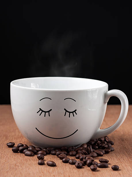 istock Coffee cup and coffee beans on wood background 485729470