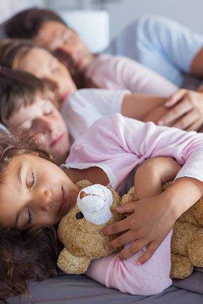 istock Cute family napping together 485730675