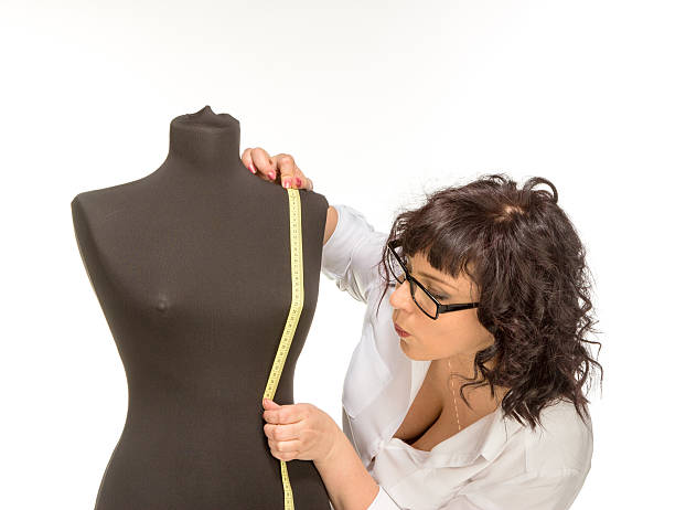 istock Adult tailor with mannequin 485730913