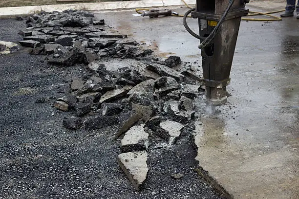 Jackhammer works. Asphalt Road repairing and Asphalt Pavement Maintenance