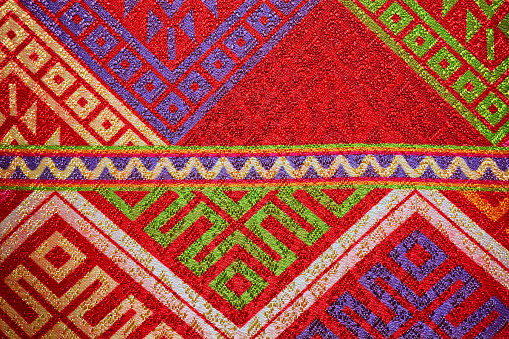 Colorful thai handcraft peruvian style rug surface close up. More of this motif & more textiles peruvian stripe beautiful background tapestry persian nomad detail pattern arabic fashionable textile.