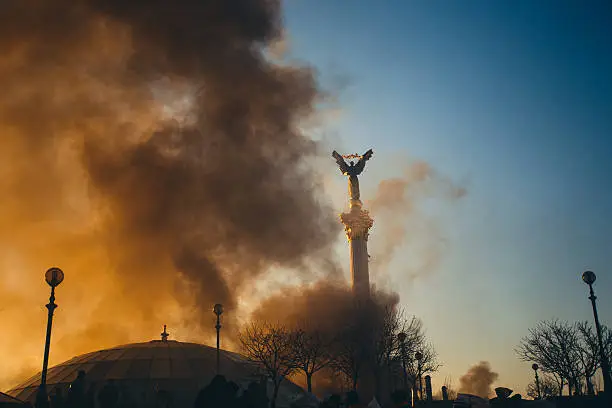 The Monument of Independence of Ukraine in smoke.