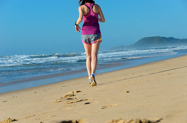 istock Woman running on beach 485733277