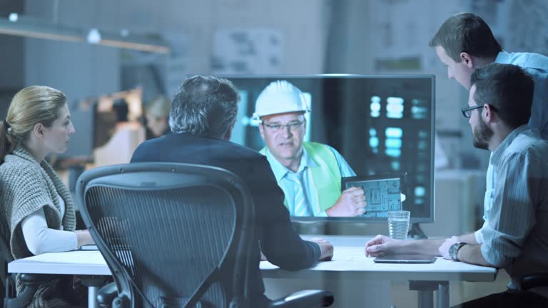 DS Architects on video call with colleague on building site