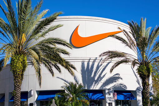 Orlando, USA - February 15, 2014: Photo of facade of Nike Store  at Orlando Premium Outlets, located at 8200 Vineland Avenue, Orlando. It was a sunny and clear day. Palm trees in front the store.