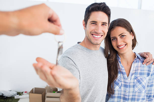 istock Happy man being given a house key 485734455