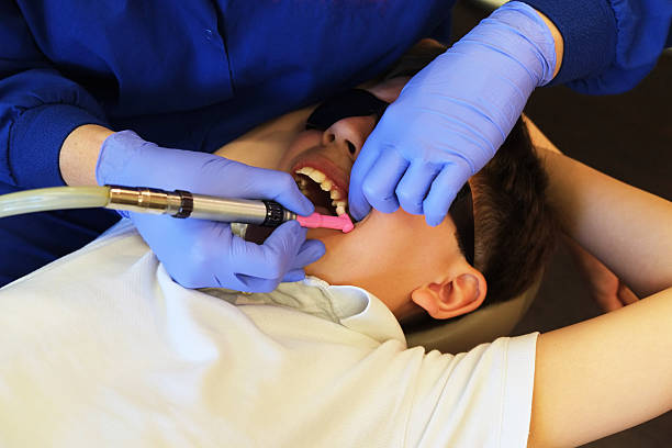 Orthodontics Visit Dental procedure in preparation for braces on a young boy. mm1 stock pictures, royalty-free photos & images