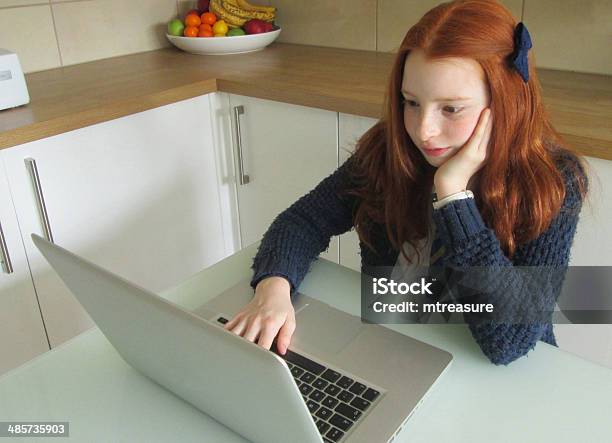 Girl Sat In Front Of Laptop Stock Photo - Download Image Now - Cheerful, Child, Color Image