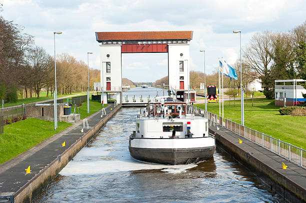 Lock gates and channels with boat stock photo