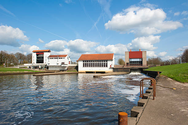Weir with pumping station and water spill chamber in a dam at sluice complex on april 9, 2010 in the Twente channel at Eefde, the Netherlands