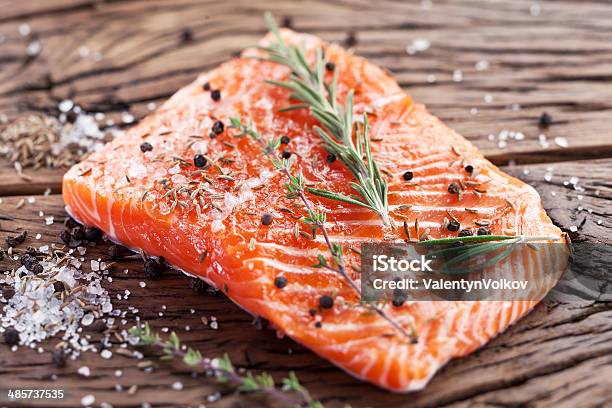 Salmon Filet On A Wooden Carving Board Stock Photo - Download Image Now - Raw Food, Fish, Salmon - Seafood