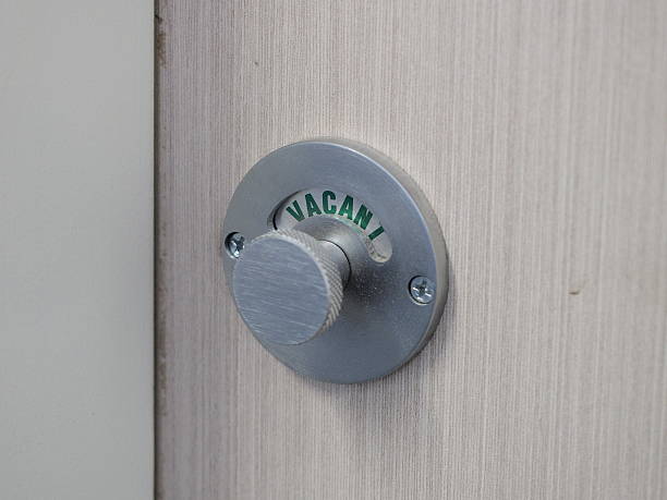 istock Lock of a shower cubicle indicating green Vacant 485738294